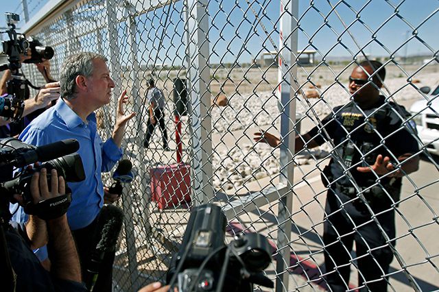 An agent with the Department of Homeland Security denies access to New York City Mayor Bill de Blasio to the holding facility for immigrant children in Tornillo, Texas, near the Mexican border in June 2018.